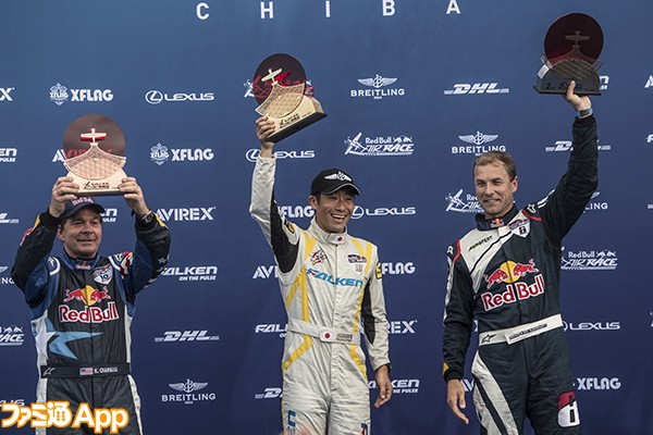 Yoshihide Muroya of Japan (C) celebrates with Martin Sonka of the Czech Republic (R) and Kirby Chambliss of the United States (L) during the Award Ceremony of the third stage of the Red Bull Air Race World Championship in Chiba, Japan on June 5, 2016.
